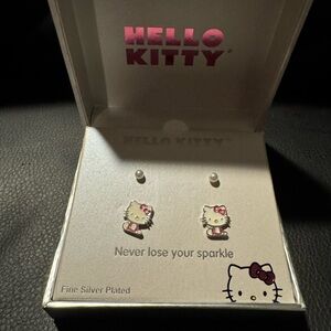 Hello Kitty Pink Bow Silver Earrings and a set of pearls earrings.